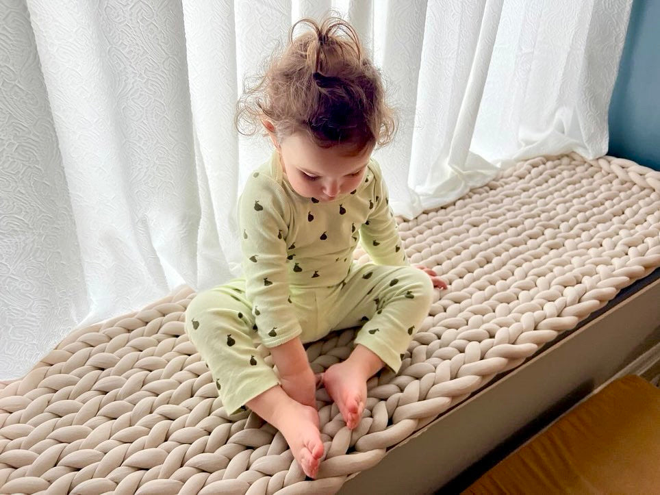 Girl sitting on custom cushion